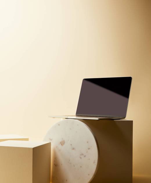 laptop with blank screen on beige cubes